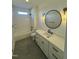 Modern bathroom with a vanity, large mirror, and bathtub at 8536 Savage Rd, Spring Hope, NC 27882
