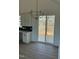 Bright dining area with sliding glass doors leading to deck and chandelier at 8536 Savage Rd, Spring Hope, NC 27882