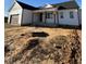 White farmhouse with covered porch and two-car garage at 8536 Savage Rd, Spring Hope, NC 27882