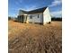 Exterior view of a charming home featuring a screened-in porch and white siding at 8536 Savage Rd, Spring Hope, NC 27882