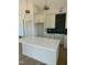 Modern kitchen island with white cabinets and quartz countertop at 8536 Savage Rd, Spring Hope, NC 27882