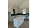 Large kitchen island with white cabinets and quartz countertop at 8536 Savage Rd, Spring Hope, NC 27882
