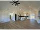 Open floor plan boasts a spacious kitchen with island, and a living room with fireplace at 8536 Savage Rd, Spring Hope, NC 27882