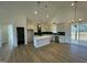 Open concept kitchen and living area featuring an island and vaulted ceiling at 8536 Savage Rd, Spring Hope, NC 27882