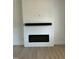 Bright living room featuring a modern fireplace and a soundbar above it at 8536 Savage Rd, Spring Hope, NC 27882