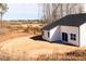 Exterior of home featuring backyard and construction equipment in the distance at 326 Little Creek Dr, Lillington, NC 27546