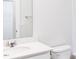 Bright bathroom featuring a modern vanity with a white countertop and fixtures at 326 Little Creek Dr, Lillington, NC 27546