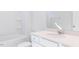 Clean bathroom showcasing a white vanity with a large mirror and a tub with shower at 326 Little Creek Dr, Lillington, NC 27546