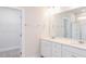 Bathroom featuring a double vanity, granite countertop, and a walk-in shower at 326 Little Creek Dr, Lillington, NC 27546