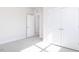 Bedroom featuring double doors, an open doorway, gray carpet and white trim throughout at 326 Little Creek Dr, Lillington, NC 27546