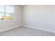 Bright bedroom with a window providing natural light and neutral carpeting at 326 Little Creek Dr, Lillington, NC 27546