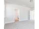 Carpeted bedroom featuring multiple doorways to other rooms in the house at 326 Little Creek Dr, Lillington, NC 27546