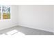 A blank canvas bedroom with plush carpeting and a window at 326 Little Creek Dr, Lillington, NC 27546