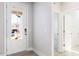 This light-filled foyer features modern flooring and convenient access to the bathroom at 326 Little Creek Dr, Lillington, NC 27546