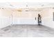 Spacious two-car garage featuring a concrete floor and installed water heater at 326 Little Creek Dr, Lillington, NC 27546
