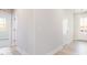 Hallway with neutral paint, connecting to various rooms of the home, and a front door at 326 Little Creek Dr, Lillington, NC 27546