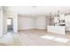 The open-concept design offers great flow from the kitchen to the spacious living room at 326 Little Creek Dr, Lillington, NC 27546