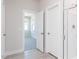 Open doorway in the main bathroom leading to a bedroom; walk-in shower also visible at 326 Little Creek Dr, Lillington, NC 27546