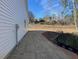 Exterior of home, showing side yard with new landscaping at 326 Little Creek Dr, Lillington, NC 27546