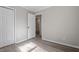 Bright bedroom with hardwood floors and double door closet at 501 Kendall Dr, Durham, NC 27703