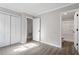 Bright bedroom with double closets and access to bathroom at 501 Kendall Dr, Durham, NC 27703