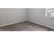 Spacious bedroom with wood-look floors and large window at 501 Kendall Dr, Durham, NC 27703