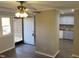 Bright entryway with wood floors and view into updated kitchen at 501 Kendall Dr, Durham, NC 27703