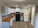 Modern kitchen with light blue cabinets and butcher block counters at 501 Kendall Dr, Durham, NC 27703
