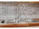 Stainless steel kitchen sink with modern faucet at 501 Kendall Dr, Durham, NC 27703