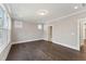 Bright bedroom featuring hardwood floors, neutral walls, and recessed lighting at 698 Magnolia Acres Ln, Fuquay Varina, NC 27526