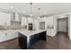 Spacious kitchen with a center island, stainless steel appliances, and pendant lighting at 698 Magnolia Acres Ln, Fuquay Varina, NC 27526