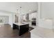 Bright kitchen with a dark island and stainless steel appliances at 698 Magnolia Acres Ln, Fuquay Varina, NC 27526