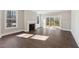 Cozy living room featuring a fireplace and access to the outdoor patio at 698 Magnolia Acres Ln, Fuquay Varina, NC 27526