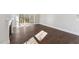 Bright living room featuring dark hardwood floors, a fireplace, and sliding doors at 698 Magnolia Acres Ln, Fuquay Varina, NC 27526
