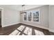 Dining room with large windows offering plenty of natural light at 698 Magnolia Acres Ln, Fuquay Varina, NC 27526
