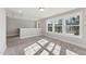 Bright loft space featuring large windows providing lots of natural light at 698 Magnolia Acres Ln, Fuquay Varina, NC 27526