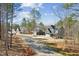 Charming street view showcasing multiple well-maintained homes nestled among tall, mature trees on a sunny day at 698 Magnolia Acres Ln, Fuquay Varina, NC 27526