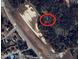 Aerial view of a partially wooded lot, offering privacy and a convenient location near the highway at 7925 S Highway 55, Willow Springs, NC 27592