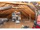 Unfinished attic space with storage shelving at 7925 S Highway 55, Willow Springs, NC 27592