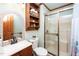 Bathroom with wood shelving, shower, and toilet at 7925 S Highway 55, Willow Springs, NC 27592