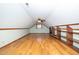 Spacious bonus room with built-in shelving and hardwood floors at 7925 S Highway 55, Willow Springs, NC 27592