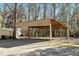 Covered carport structure for parking and protection from weather at 7925 S Highway 55, Willow Springs, NC 27592