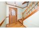 Inviting entryway with wood staircase and glass door at 7925 S Highway 55, Willow Springs, NC 27592