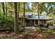 Two-story house with a large back patio and wooded setting at 7925 S Highway 55, Willow Springs, NC 27592