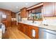 Modern kitchen with granite countertops and wooden cabinets at 7925 S Highway 55, Willow Springs, NC 27592