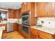 Double oven and granite countertops in this kitchen at 7925 S Highway 55, Willow Springs, NC 27592