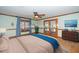 Main bedroom with hardwood floors and access to backyard patio at 7925 S Highway 55, Willow Springs, NC 27592