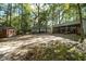 Gravel area with shed, small house, and covered storage at 7925 S Highway 55, Willow Springs, NC 27592