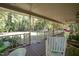 Spacious front porch with seating and wooded view at 7925 S Highway 55, Willow Springs, NC 27592
