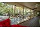 Covered porch overlooking backyard and patio at 7925 S Highway 55, Willow Springs, NC 27592